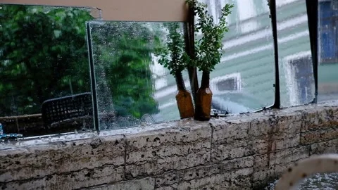 Empty street cafe. Heavy rain and hail. Slow motion Stock Footage 198034597