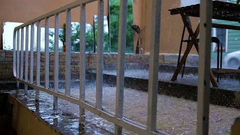 Empty street cafe. Heavy rain and hail. Slow motion Stock Footage 203173611
