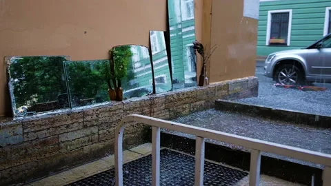 Empty street cafe. Heavy rain and hail. Slow motion Stock Footage 203173668