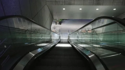 Empty Street Escalator moving down Symmetrical Wide Shot in Modern Building Stock Footage 340183572