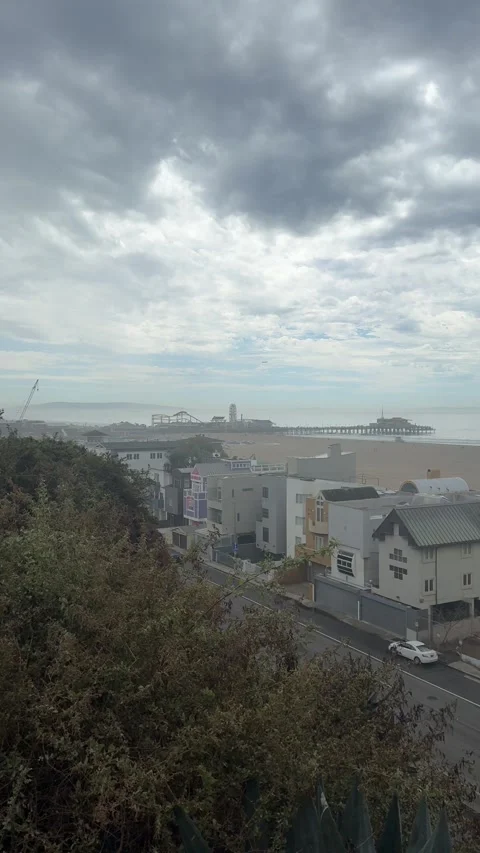 Empty street with pier on overcast hillside, Santa Monica Stock Footage 345266100