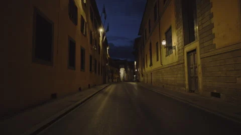 Empty street with road old building and glowing lights at night Florence Italy Stock Footage 307304670