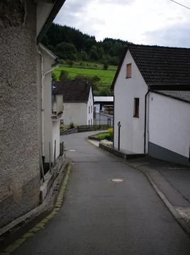 Empty street of small modern quiet European village  Stock Photos