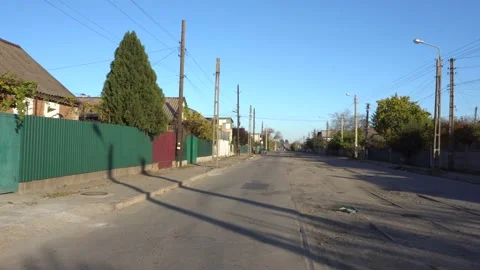 Empty Street Of A Small Poor Town With Bad Roads And Sidewalks During Quarantine Stock Footage 143275652