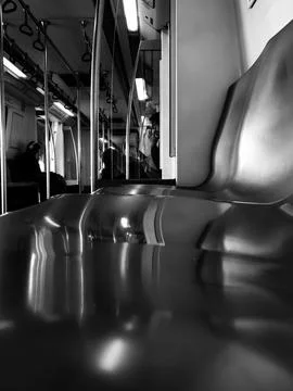 Empty Subway Car Interior with Reflections in Black and White Stock Photos