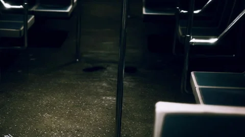 Empty subway car at night with dim lighting and wet floor Stock Footage 340996809