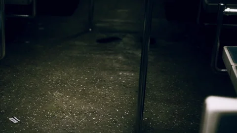 Empty subway car at night with dim lighting and wet floor Stock Footage 340996981