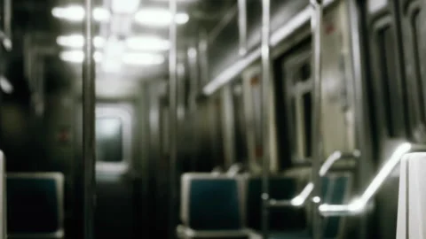 Empty subway car shows close up view of metal poles and seats during quiet ride Stock Footage 340619026