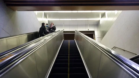 Empty Subway Escalator with Few People all Wearing Masks Stock Footage 124577586