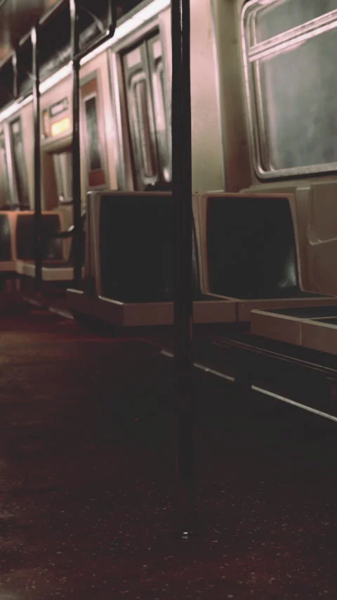 Empty subway train interior at night with reflections on the floor Stock Footage 338354379