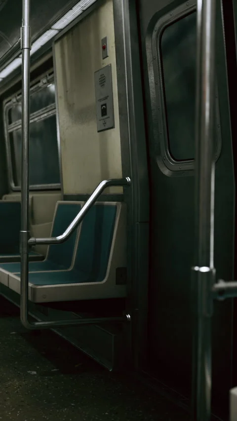 Empty subway train interior at night with seats and grab bars visible Stock Footage 338415692