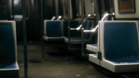 Empty subway train seats in a quiet station during early morning hours Vídeos de archivo 339497275