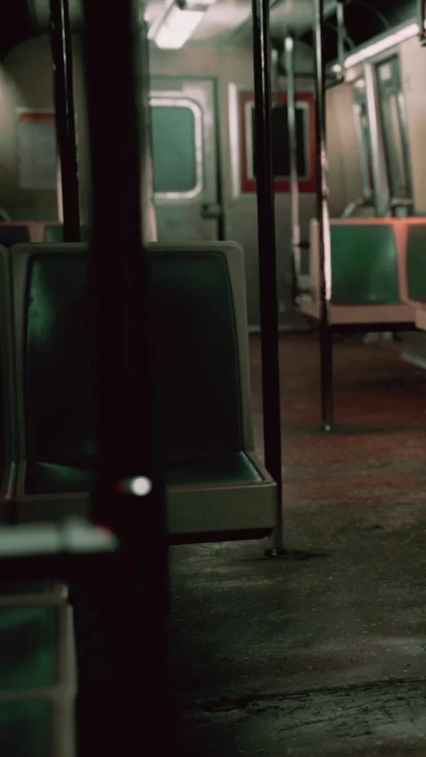 Empty subway train station at night with green and gray seats Stock Footage 342176434
