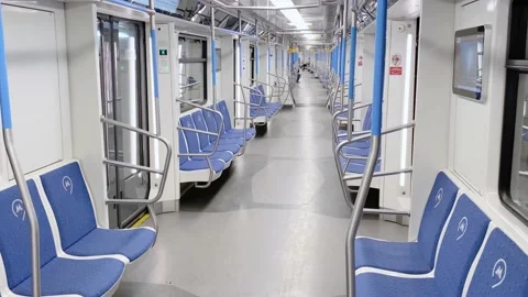 Empty subway wagon with blue seats moves through tunnel Stock Footage 193965399