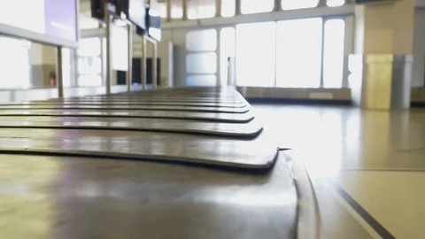 Empty suitcase and luggage transport at the airport Stock Footage 107381053