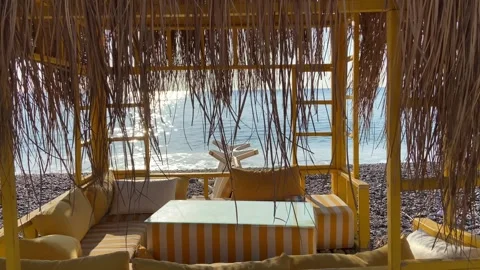 Empty summer beach cafe with sea view in sunset Video stock 314395109