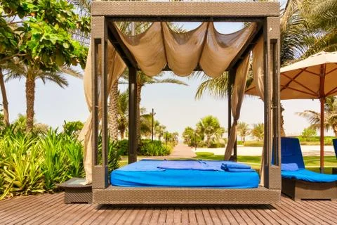 Empty sun bed in a Dubai luxury resort. No tourists on the beach. Closed on q Stock-Fotos