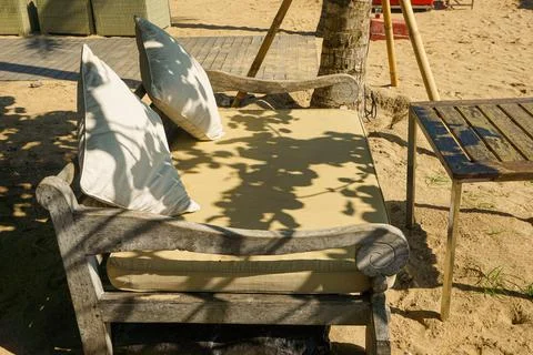 Empty sunbed in front of beach Stock Photos