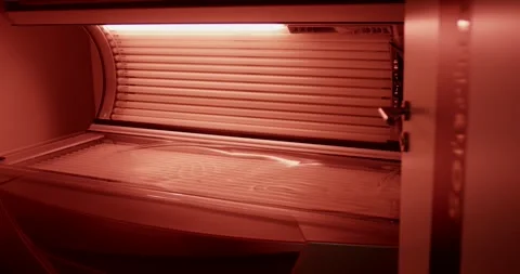Empty Sunbed with Glowing Red Lamps in Solarium, Beauty Studio, Close Up Shot Stock Footage 340366509