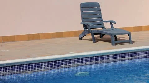 Empty sunbed at swimming pool 스톡 동영상 12174179