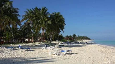 Empty sunbeds with parasols at the beach of the Cayo Levisa island. Cuba. Stock Footage 71157281