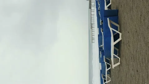 Empty sunbeds on sandy beach. Vertical video. Empty beaches during lockdown Stock Footage 238768705