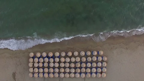 Empty sunbeds at the seaside, aerial Stock Footage 86196163