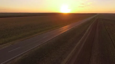 Empty Sunset Road Camera moving towards the sun along the road Stockbeeldmateriaal 68863208