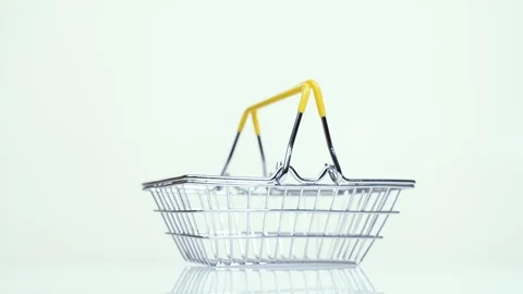 Empty supermarket basket rotates on a white background Stock-Footage 124477181