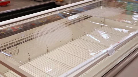 Empty supermarket refrigerator freezer display with no products Stock Footage 330678370