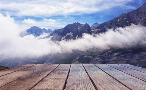 Empty surface of the wooden table against the background of a landscape of sn Stock Photos