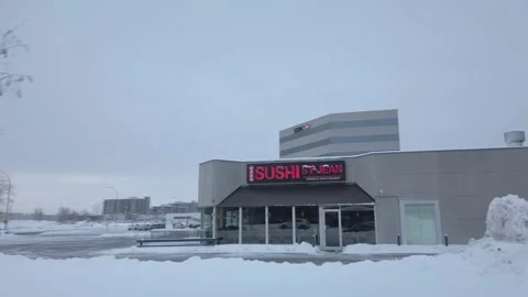 Empty Sushi Buffet Restaurant on Snowy Winter Morning Stock Footage 230694647
