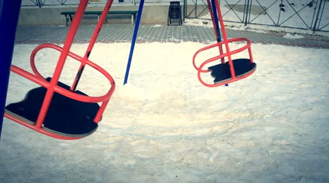 The empty swaying swings on the playground. Stock Footage 35163041