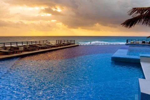 Empty swimming pool and ocean Stock Photos