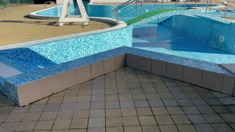 Empty swimming pool. Closed down swimming pool, restriction. Cleaning, repair 스톡 동영상 312318040