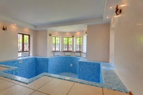 Empty swimming pool in house. first floor in cottage. 写真素材