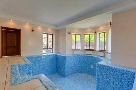 Empty swimming pool in house. first floor in cottage. Stock Photos