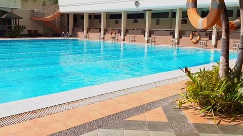Empty Swimming Pool with Starting Blocks in Bright Morning Light Stock Footage 316474810