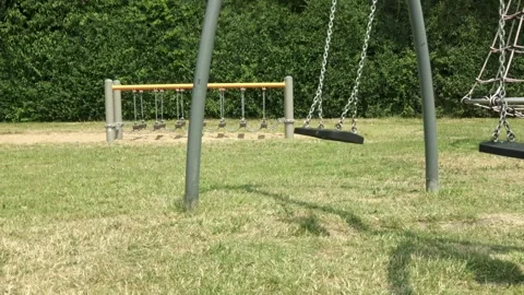 Empty swing and ball after child's disappearance Video stock 253702289