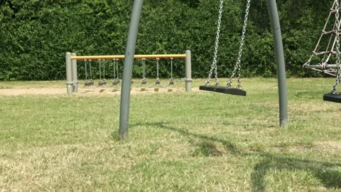 Empty swing and ball in the playground 動画素材 253702652
