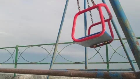 Empty swing on chains is swinging Video stock 301420851