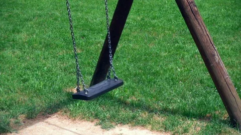 Empty swing at child playground Stock-Footage 110264695