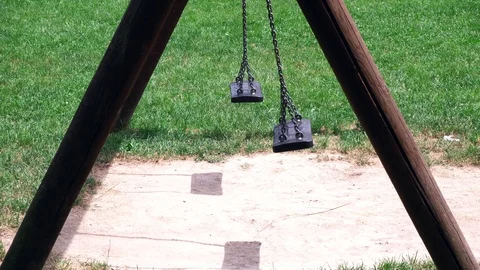Empty swing at child playground Stock-Footage 110264835