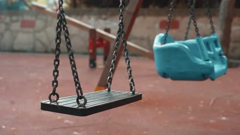 Empty swing on children playground Stock Footage 130442881