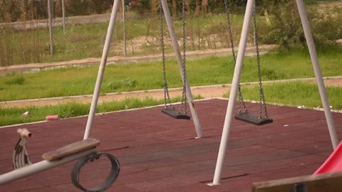 Empty swing on children playground Stock Footage 146689097
