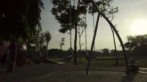 Empty swing on children playground Stock Footage 209170644