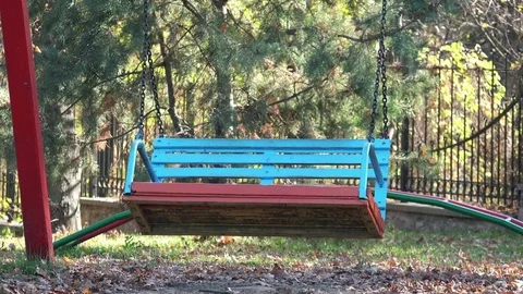 Empty Swing on Children Playground in the Park. 4K Ultra HD Stock Footage 81801729