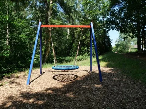 Empty swing on the children's playground Stock Photos