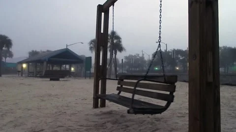 Empty swing moving by itself on foggy beach Stock-Footage 45288845