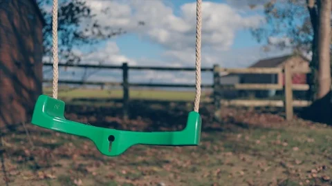 Empty Swing moving in the wind Stock Footage 96716680